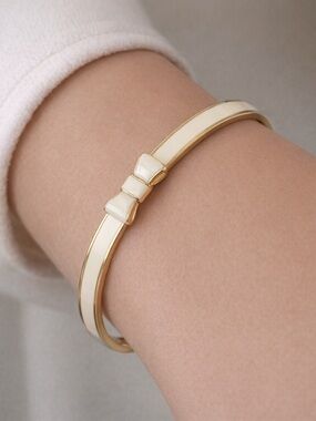 Kate Spade “Take a Bow” Cream Enamel Bow Bangle Bracelet NWT